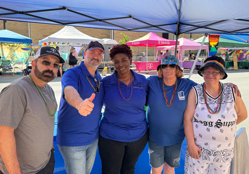 Smiling group of LLGI supporters at Pride Fest in Springfield, Illinois.