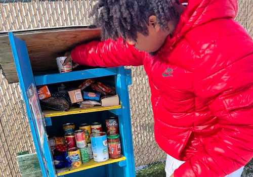 Youth filling micro pantry